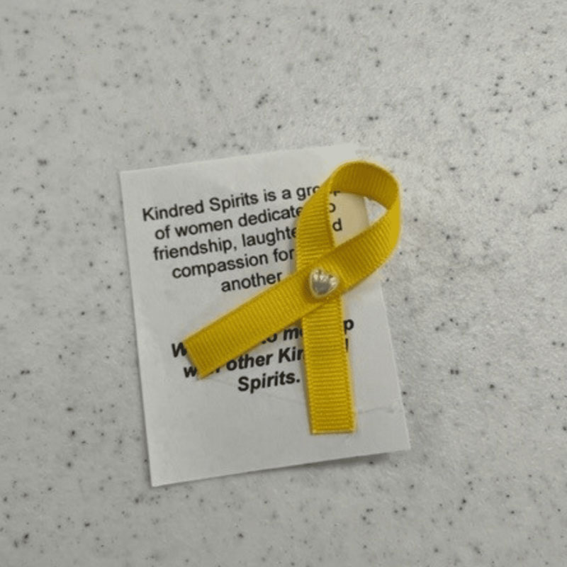 Yellow Ribbon representing women in the Kindred Spirits Club.
