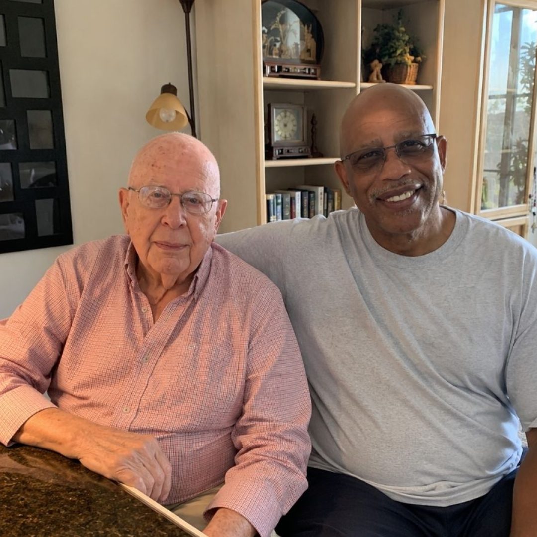 Senior Companion Volunteer Herman Archie and Client Murph Senior Companion volunteer Herman Archie visits with client Murph in his home, providing companionship and support to help him remain independent.
